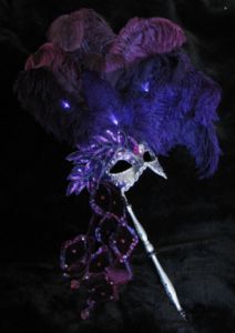 Purple feather venetian stick masquerade ball mask made by www.socaldesignco.com