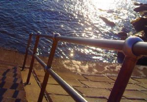 AAG Photographic,Rees Adams-Hand Rail by the Sea